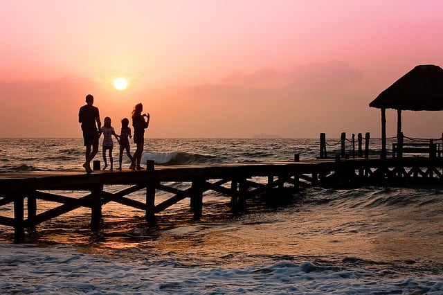 family on pier. Image by Jill Wellington from Pixabay