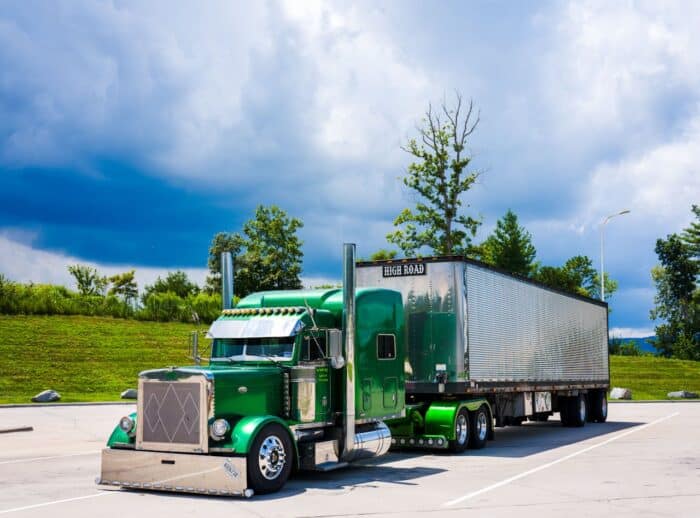 Photo by R9 Media Photo Collective: https://www.pexels.com/photo/green-semi-truck-parked-under-dramatic-sky-33262905/