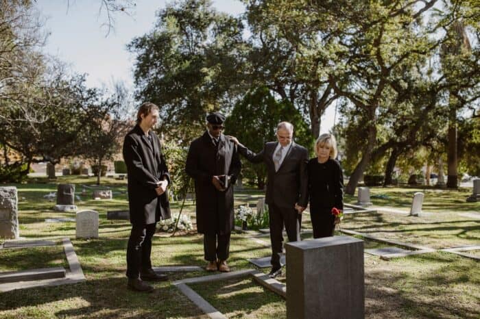Photo by RDNE Stock project: https://www.pexels.com/photo/people-weraing-black-and-standing-over-a-grave-6841459/
