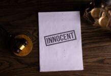 Can Criminal Charges Be Dropped in Illinois? Key Factors That Affect Your Case Photo by KATRIN BOLOVTSOVA: https://www.pexels.com/photo/close-up-view-of-a-text-on-a-paper-beside-a-gavel-6077448/