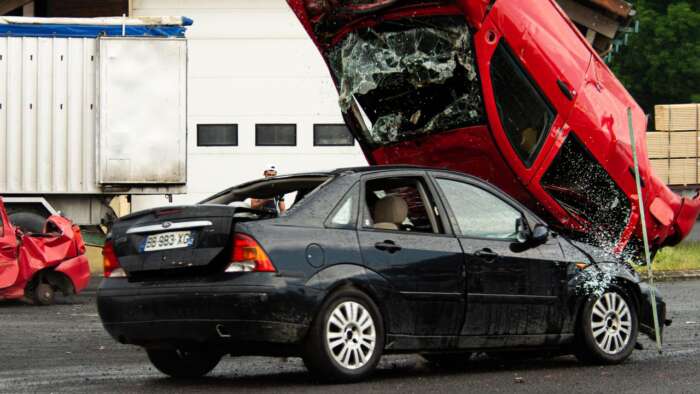 Photo by jordan besson: https://www.pexels.com/photo/dramatic-car-stunt-collision-during-live-performance-29271763/